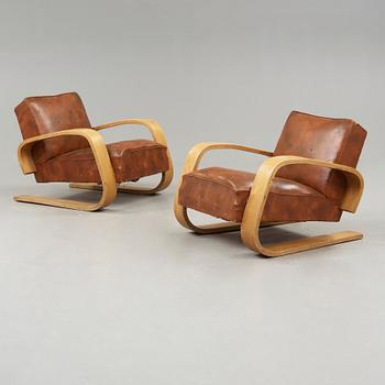 Alvar Aalto, a pair of 'tank chairs' model 400, Huonekalu-ja Rakennustyötehdas Oy for Artek, Finland 1940's-50's.