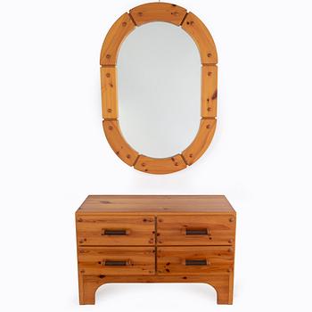 A 1970's set with a pine mirror and chest of drawers.