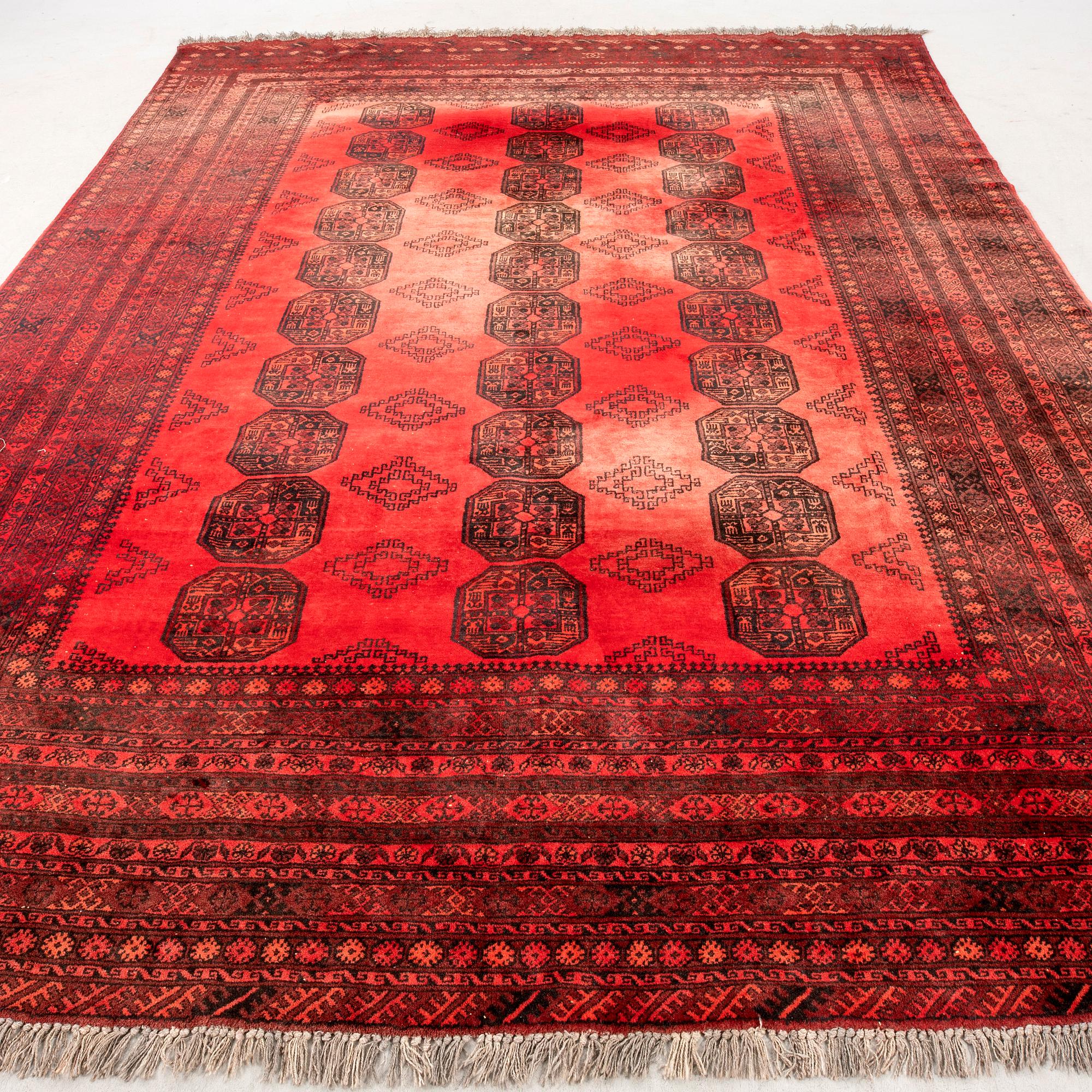 A semaintique Afghan carpet ca 390x300 cm.