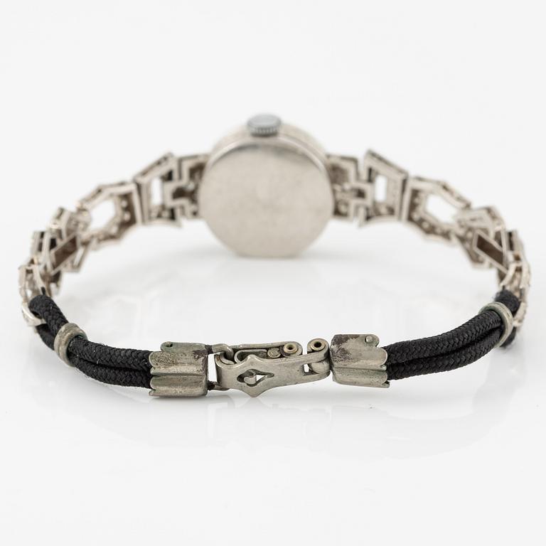 Damarmbandsur, platina med åttkantslipade diamanter, med textilrem.