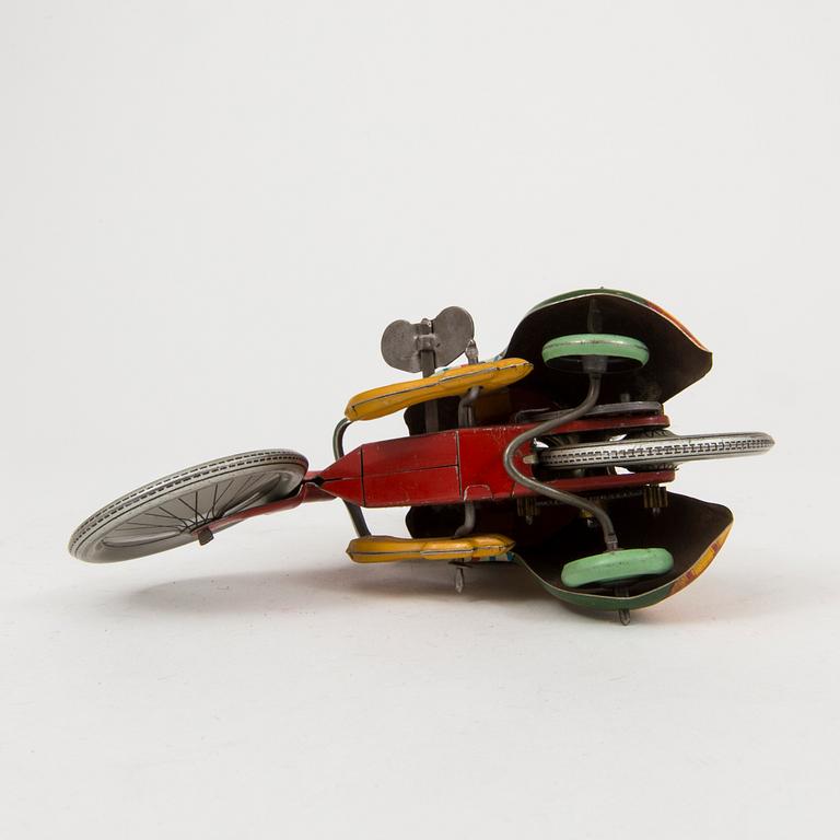 A tinplate Technofix bicycling clown Germany c. 1950.