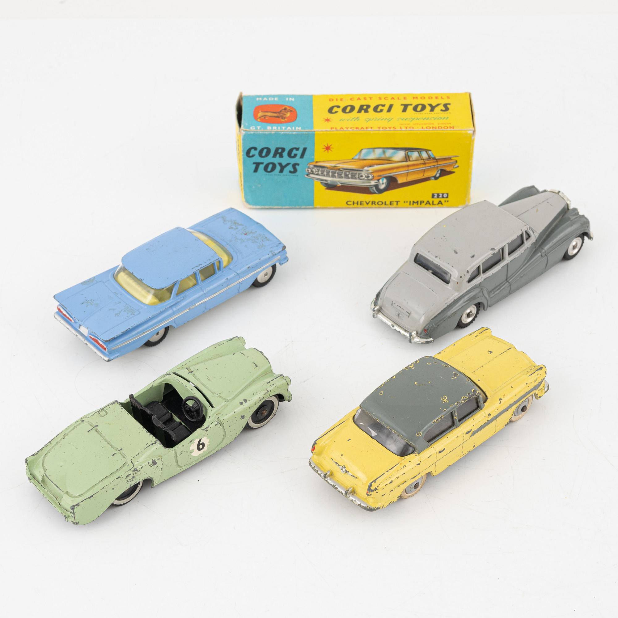 Nine toy cars, mostly Dinky toys.