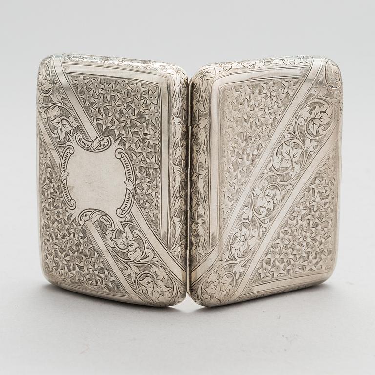 An English sterling silver cigarette case, maker's mark William M. Hayes, of Birmingham, 1896.
