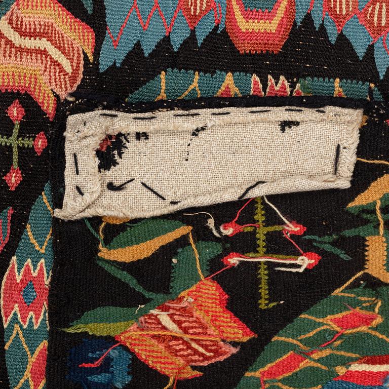 A carrige cushion, "Bebådelsen", tapestry weave, ca 105 x 52 cm, Skåne, 1800-1830.