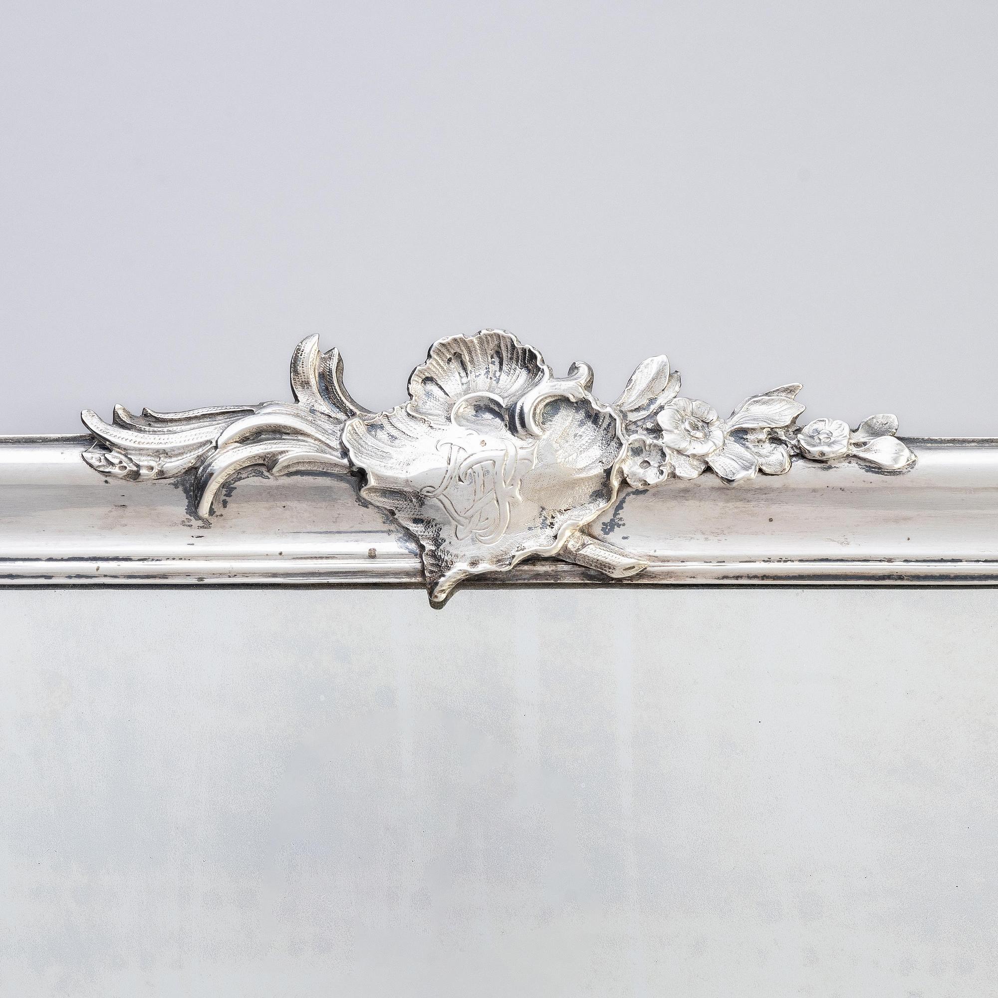 A Swedish Rococo mid-18th century mirror with silver frame  signed by Christian Precht.