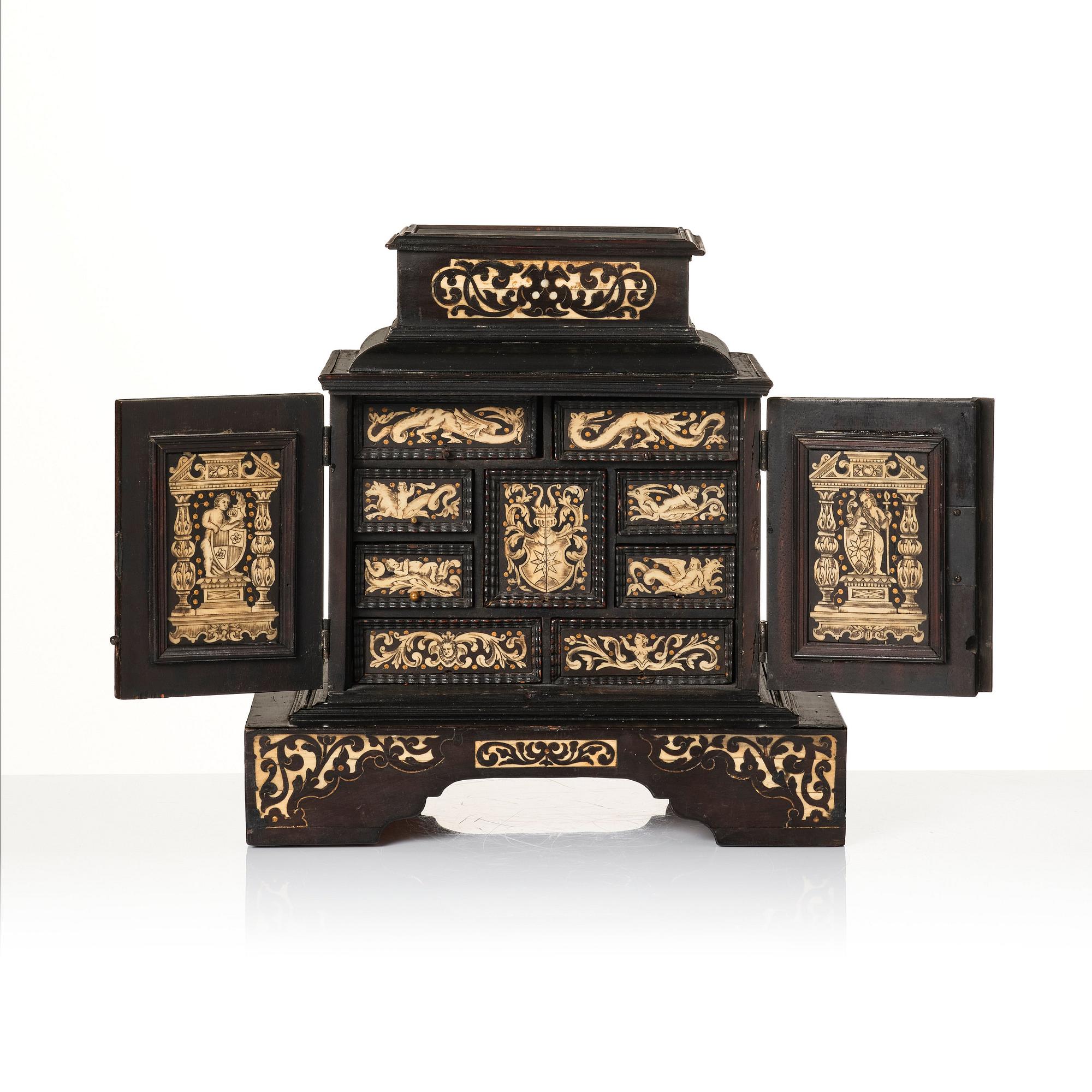 A South German, presumably Augsburg, ebony, ebonised and engraved bone inlaid table cabinet,  17th century.