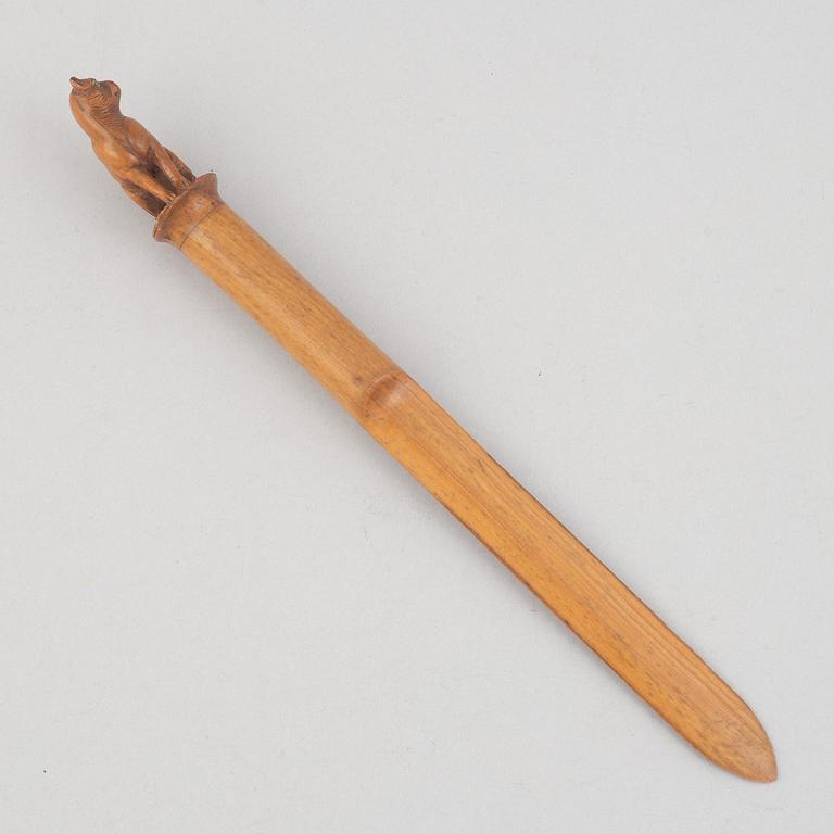 A carved wooden letter opener in the manner of Sophia Isberg, 19th century.