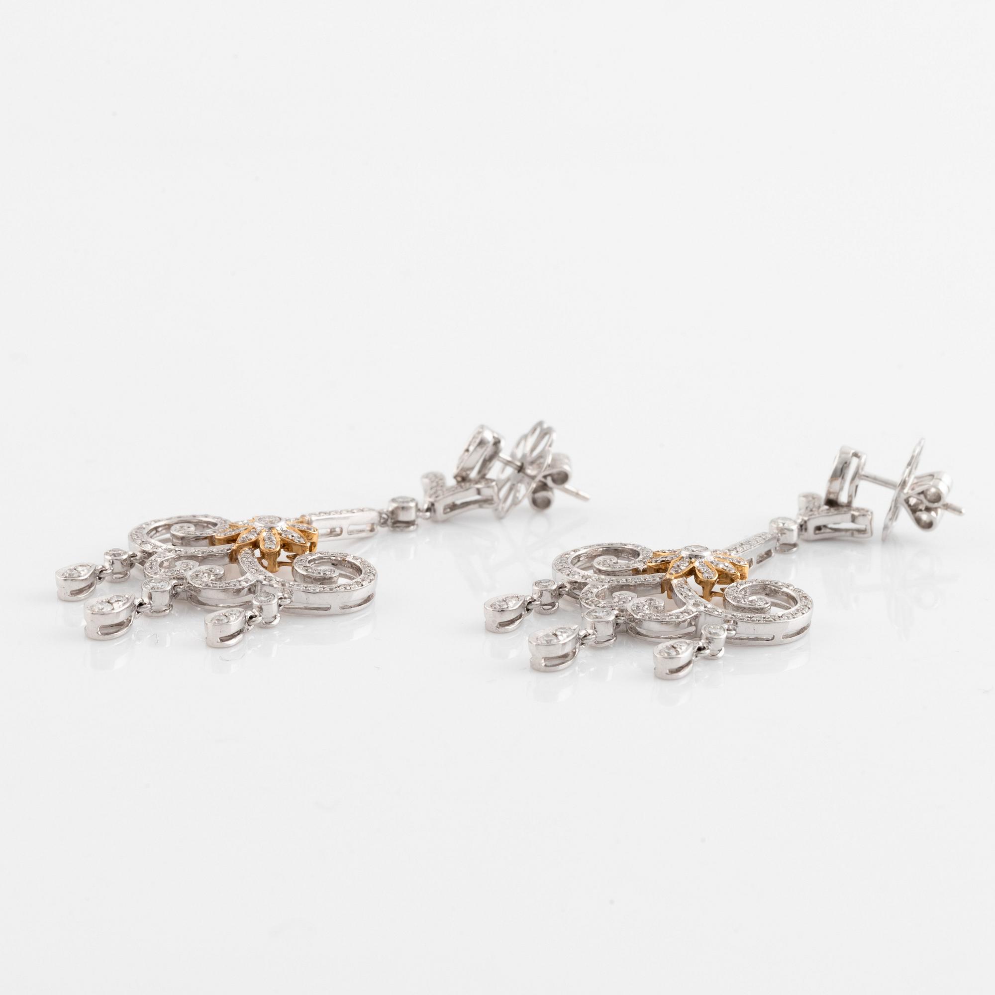 A pair of 18K white gold and round brilliant cut diamond chandelier earrings.
