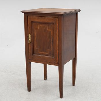 A bedside table, circa 1900.