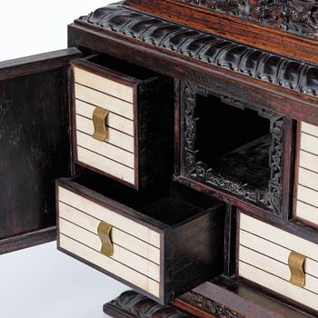 A hardwood dragon cabinet, Qing dynasty 18/19th Century.