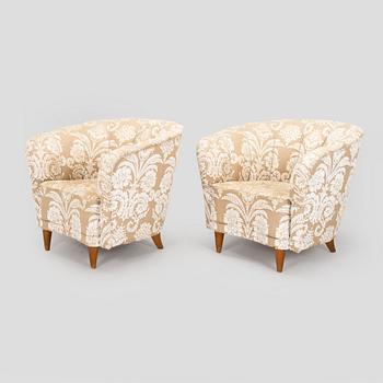 A pair of mid-20th century armchairs.