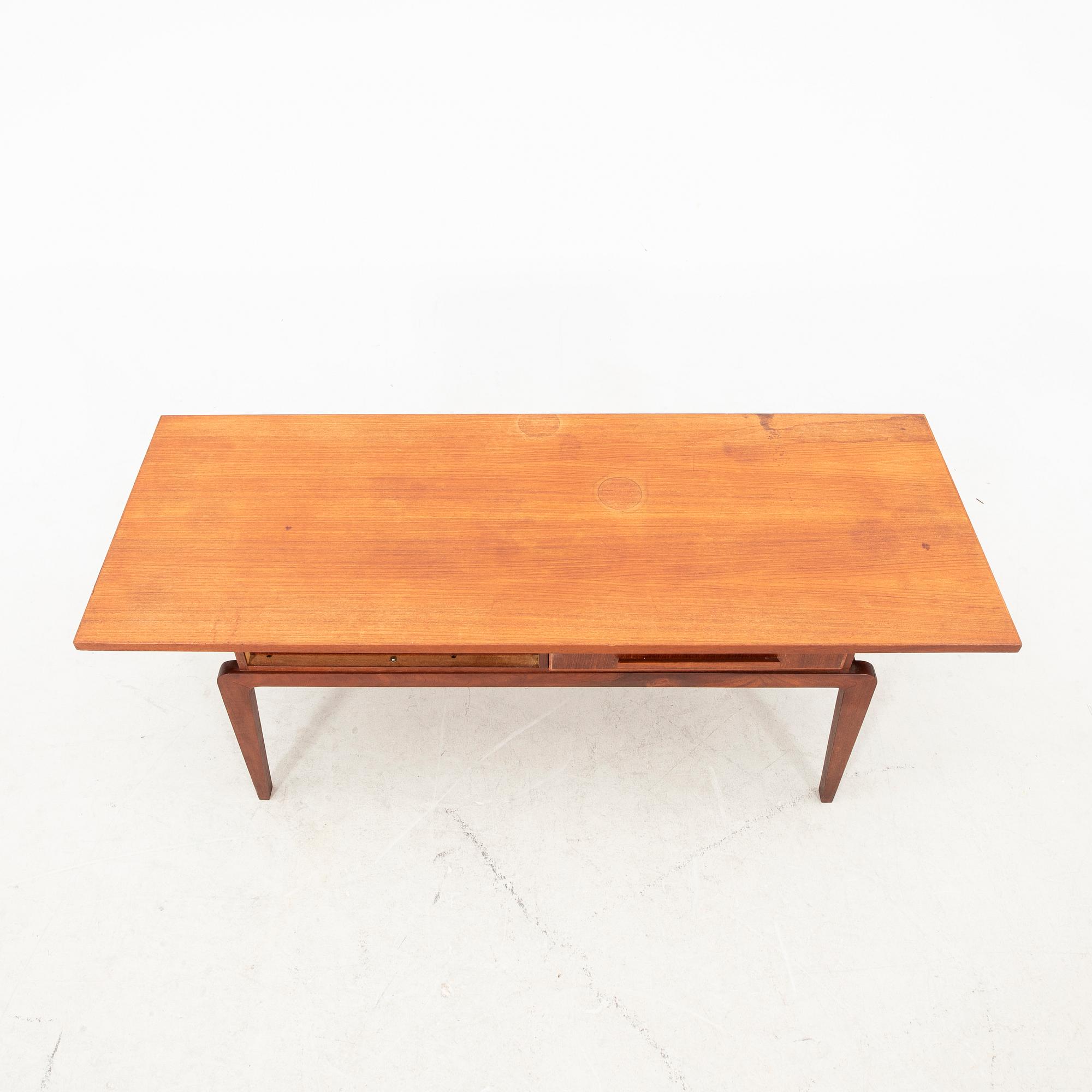 A teak coffee table from the middle of the 20th century.