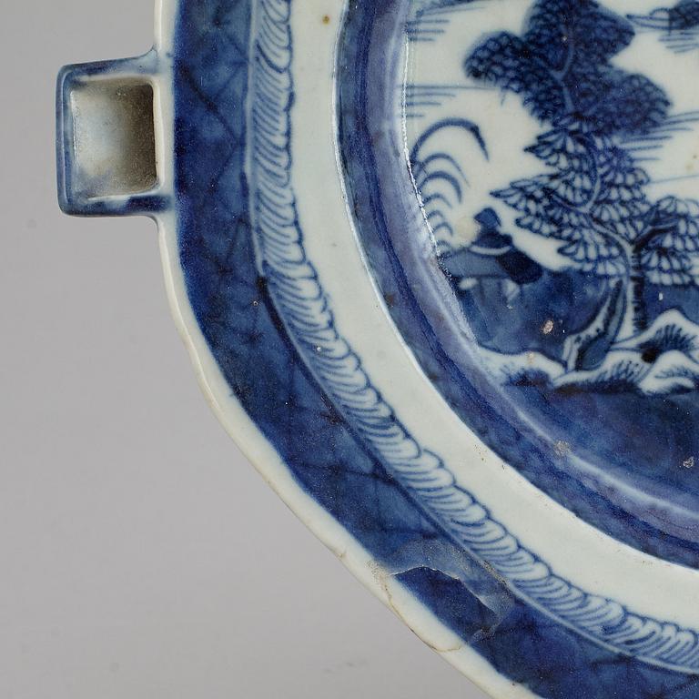 A set of three blue and white plates and a hot water dish, Qing dynasty, 18th/19th Century.