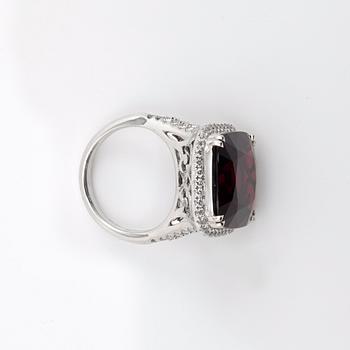 A red spinel, 18.67 cts, ring. Two certificates, AGGL, SGL.