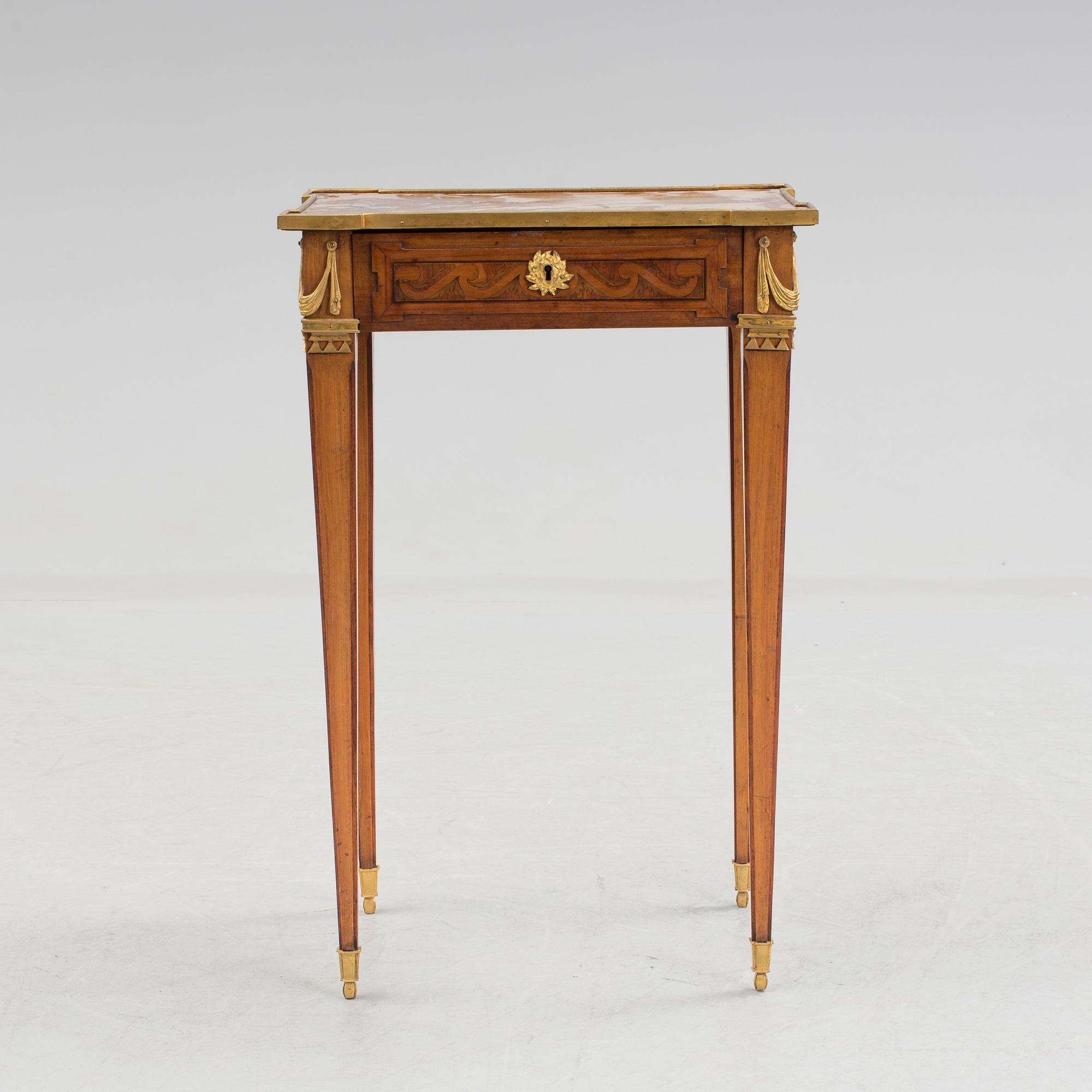 A Louis XVI-style circa 1900 occasional table.