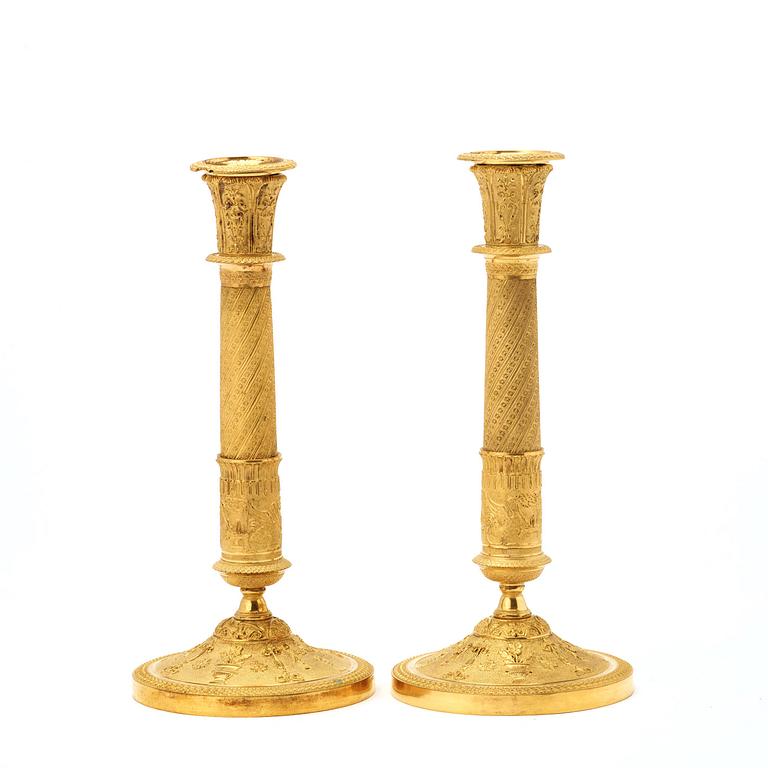 A pair of French Empire early 19th century candlesticks.