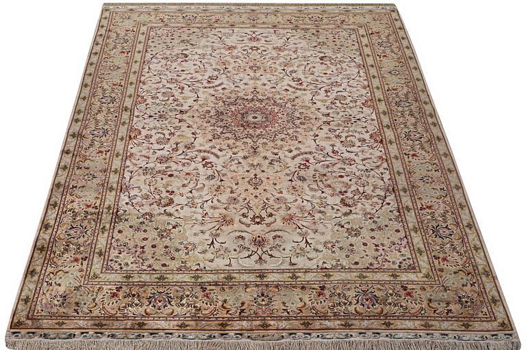 A carpet, Tabriz, with silk warp, c. 297 x 197 cm.