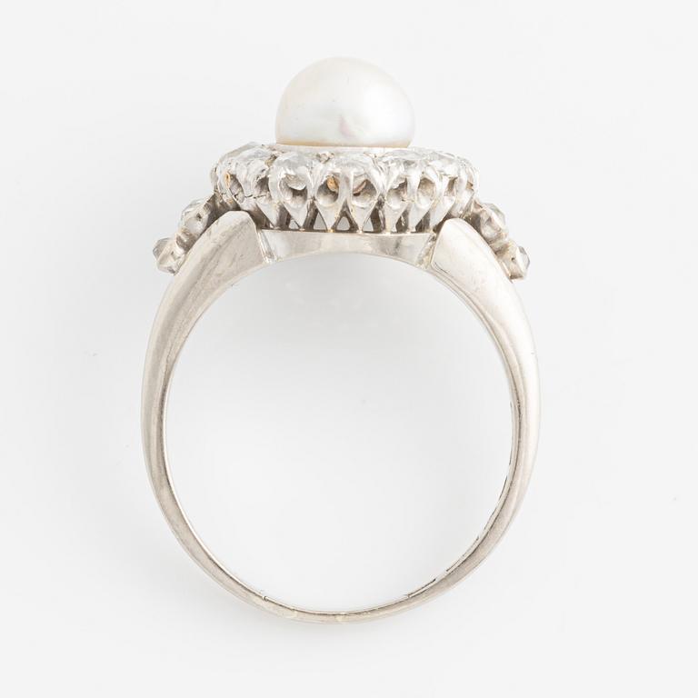 An 18K white gold ring set with a bouton pearl and old-cut diamonds.