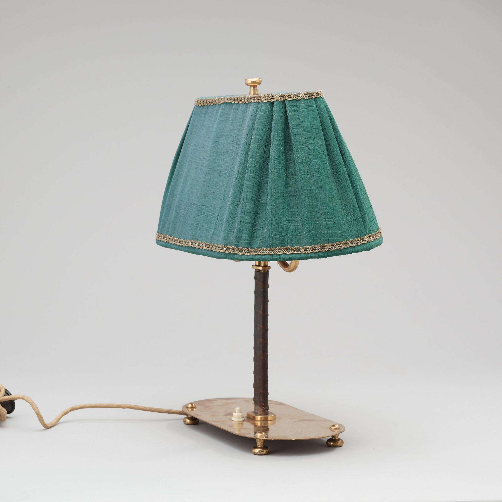 A Josef Frank brass and brown leather table lamp, model nr 2388, Svenskt Tenn 1940-50's.