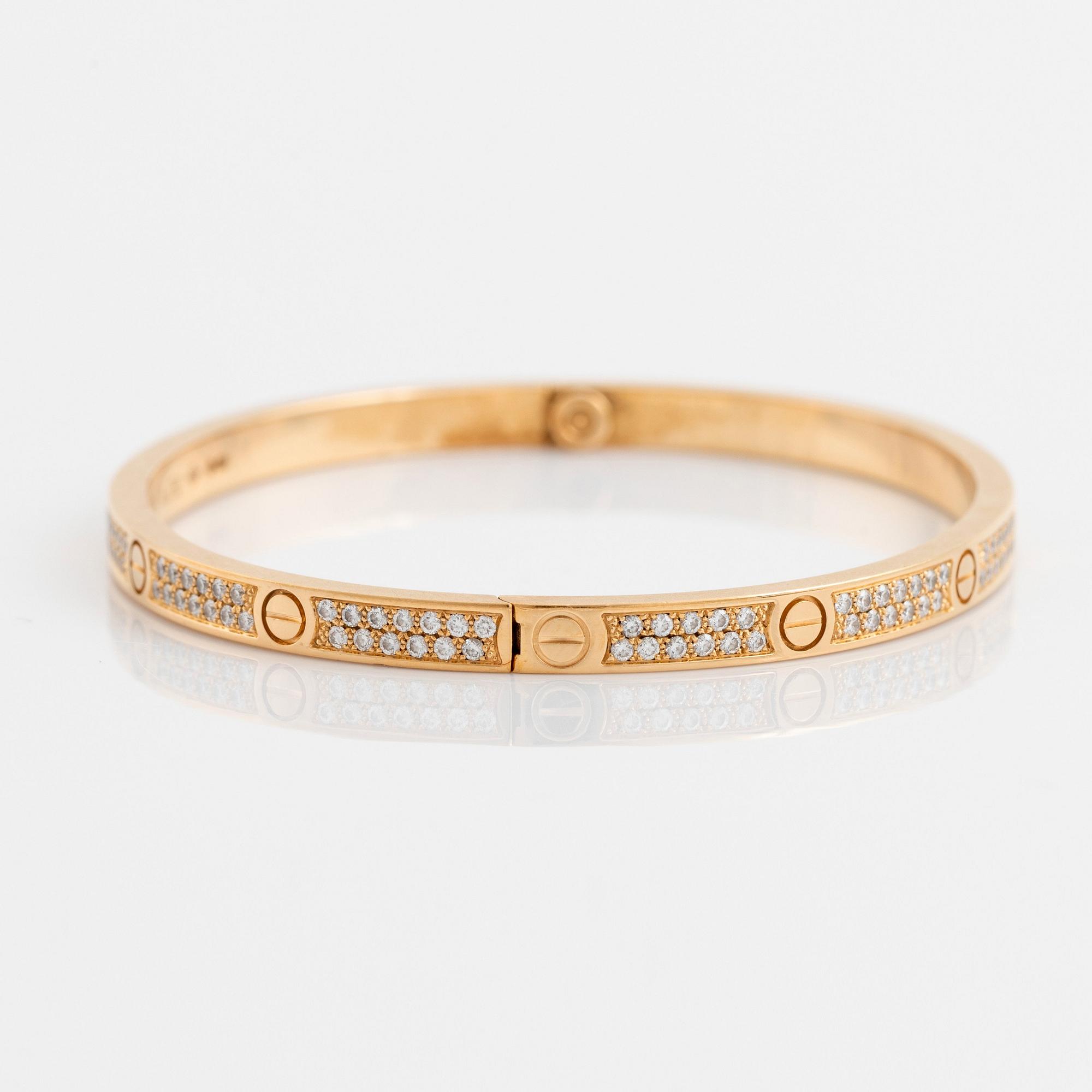 A Cartier Love bracelet small model in 18K gold set with round brilliant cut diamonds. Bukowskis
