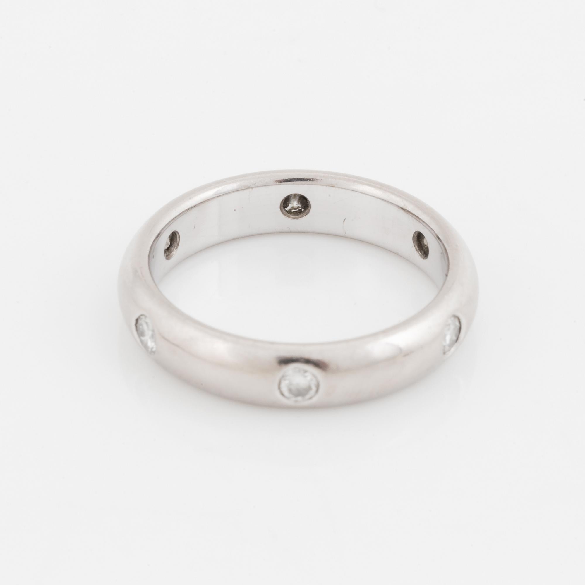 An 18K white gold Cartier ring set with round brilliant-cut diamonds.