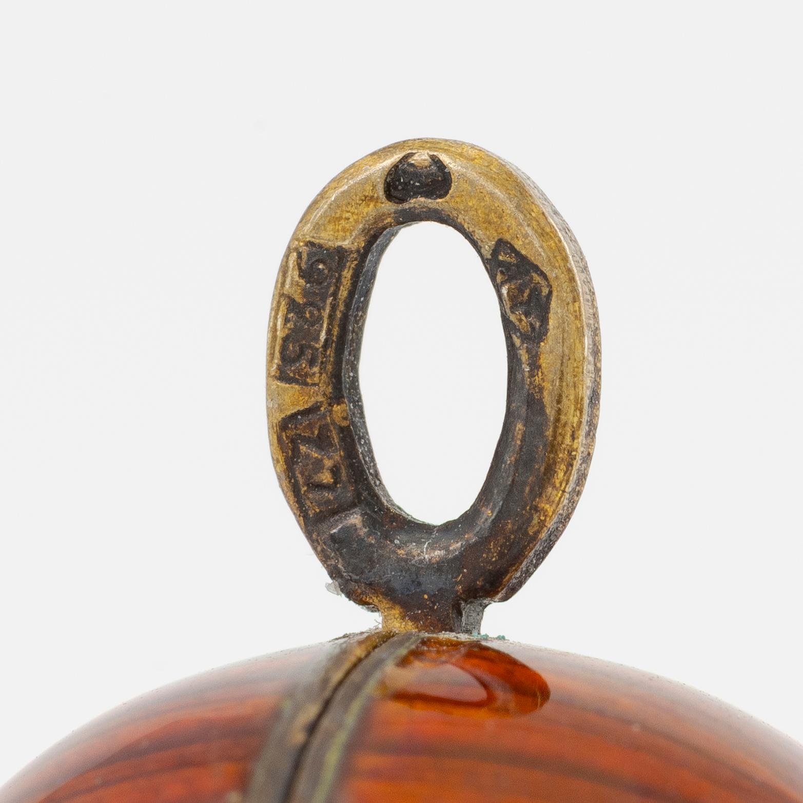 Pendant, in the form of an egg, A. Tillander, gilded silver and red enamel, Finland 1977.