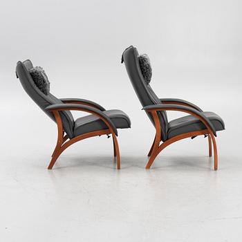 A pair of armchairs with foot stools, model 'Delta Legend' and 'Delta Legend Large', Brunstad Norway.