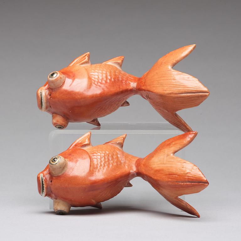 A pair of porcelain figurines of gold fishes, Qing dynasty, Qianlong (1736-95).