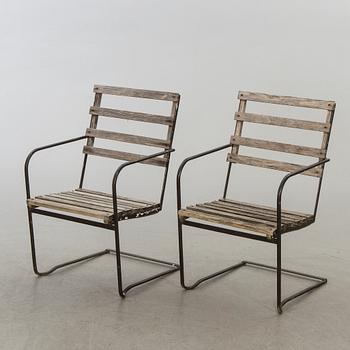 A pair of garden chairs.