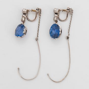 A pair of 18K white gold earrings set with faceted sapphires and old-cut diamonds.