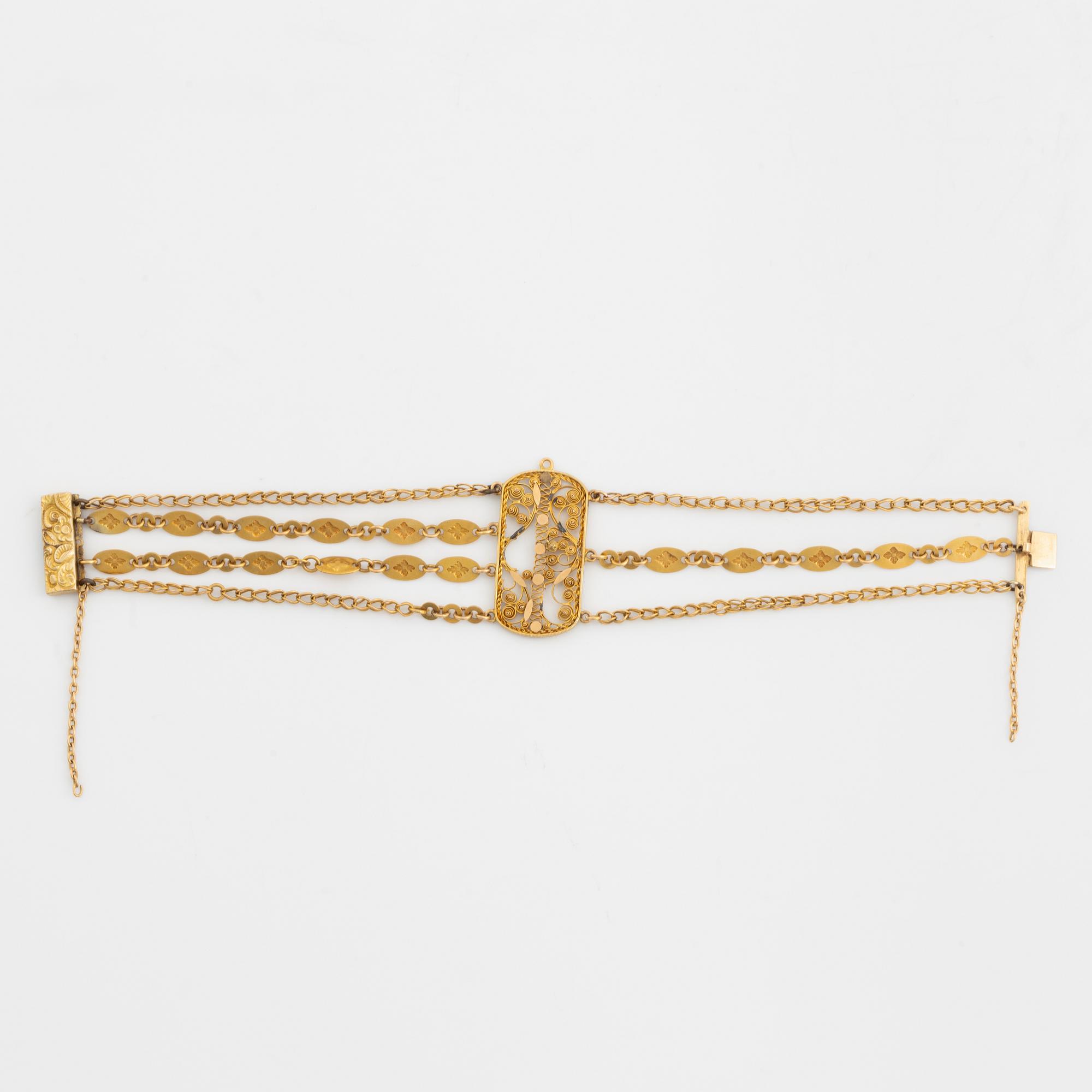 An 18K gold bracelet.