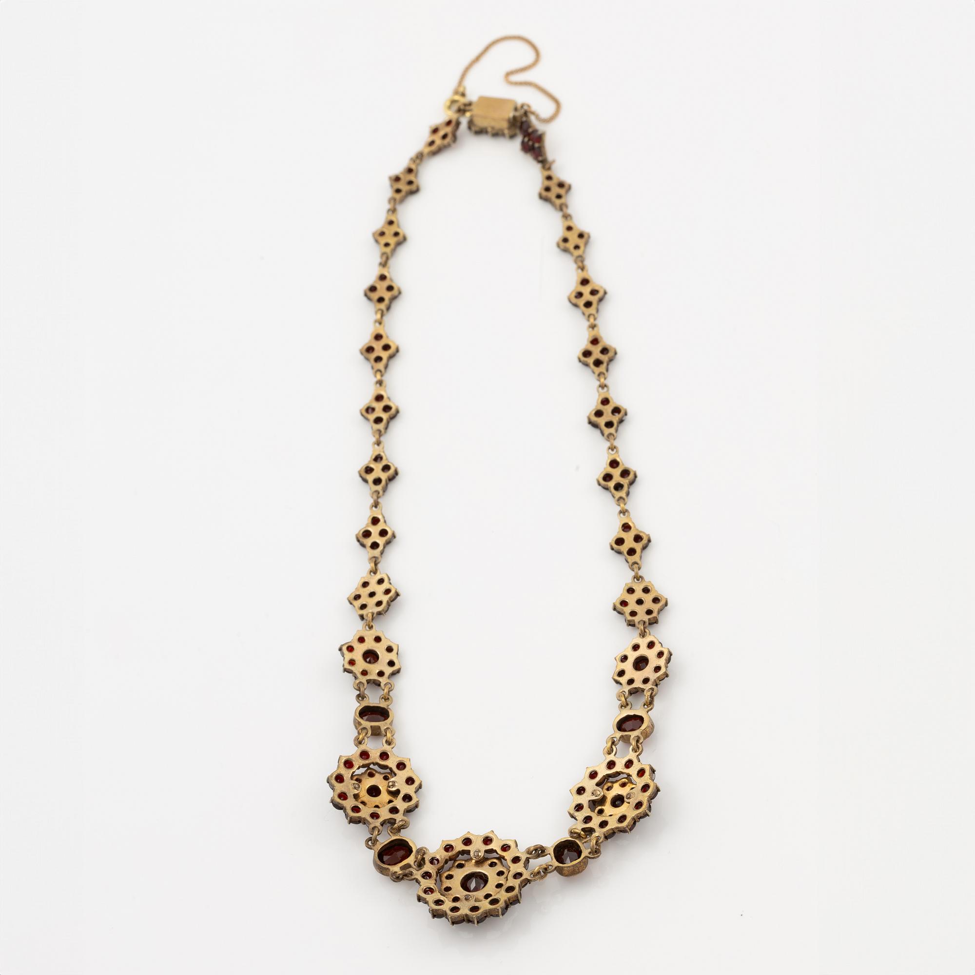 Garniture, two rings, brooch, two necklaces, and two pairs of earrings, armlet, garnets.