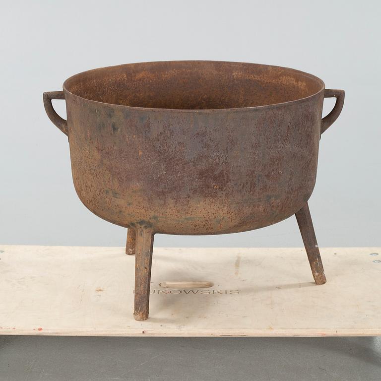 A 19th century iron pot.