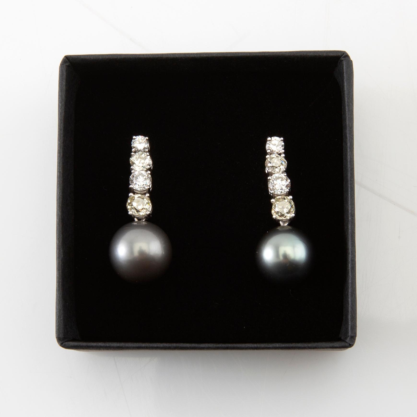 Earrings, a pair of 18K white gold with diamonds and cultured pearls.