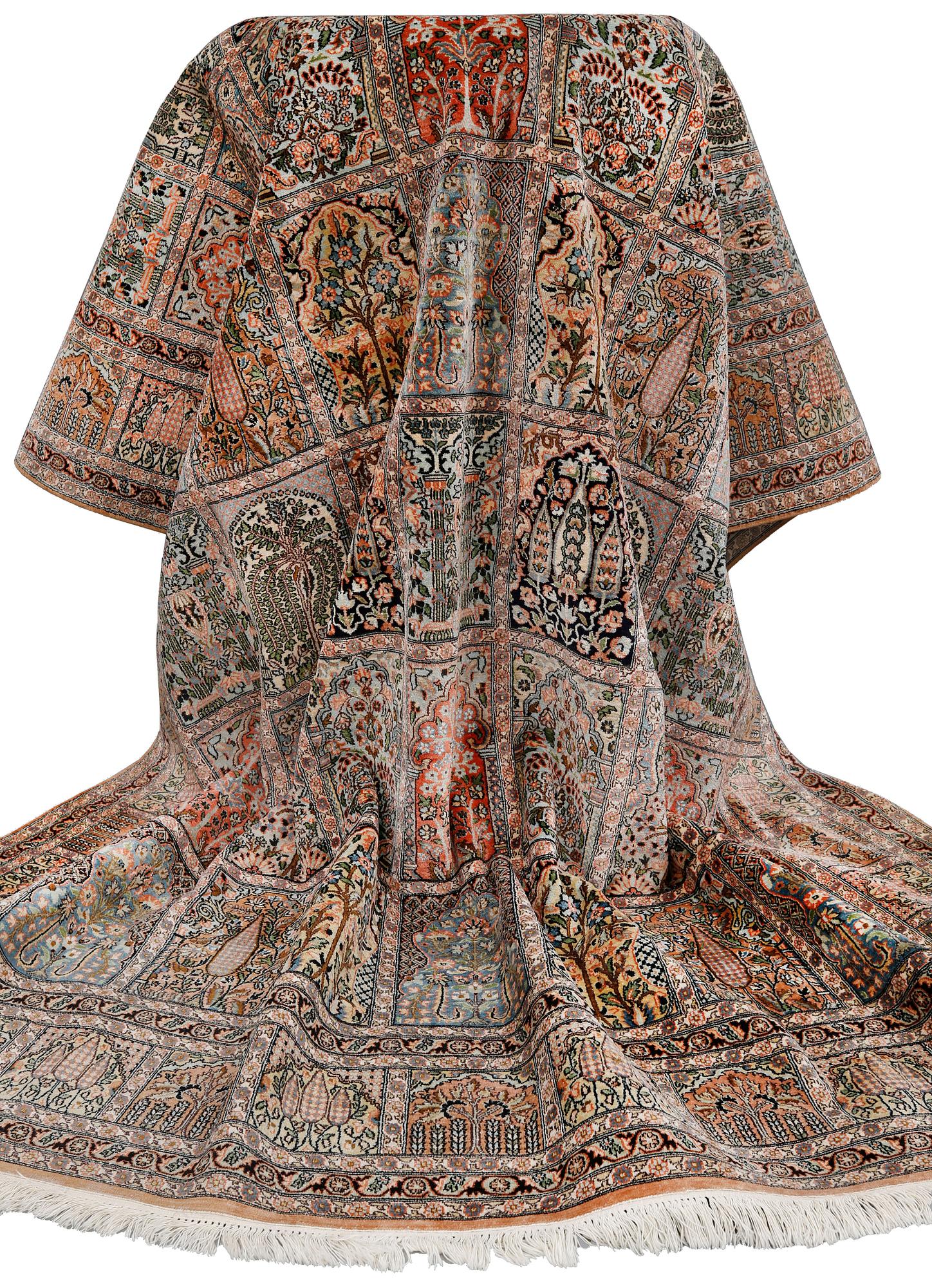 A silk Kashmir carpet, approx. 327 x 243 cm.