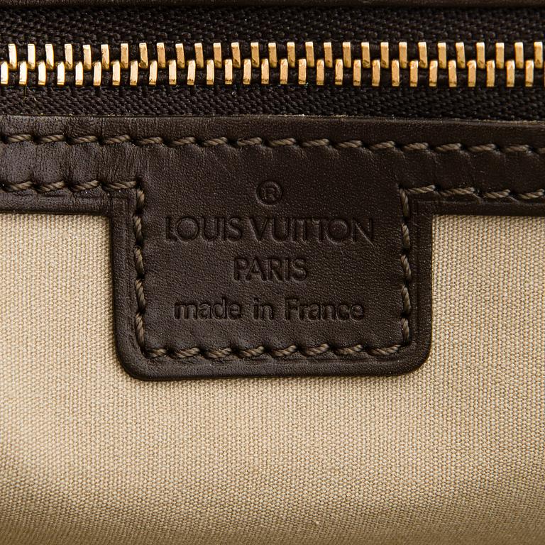 Louis Vuitton, a 'Monogram Mini Lin Alma Long Handbag'.
