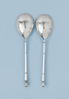 1300. A PAIR OF 19TH CENTURY RUSSIAN SILVER SPOONS, makers mark of Mikhail Grachev, St. Petersburg 1880's.