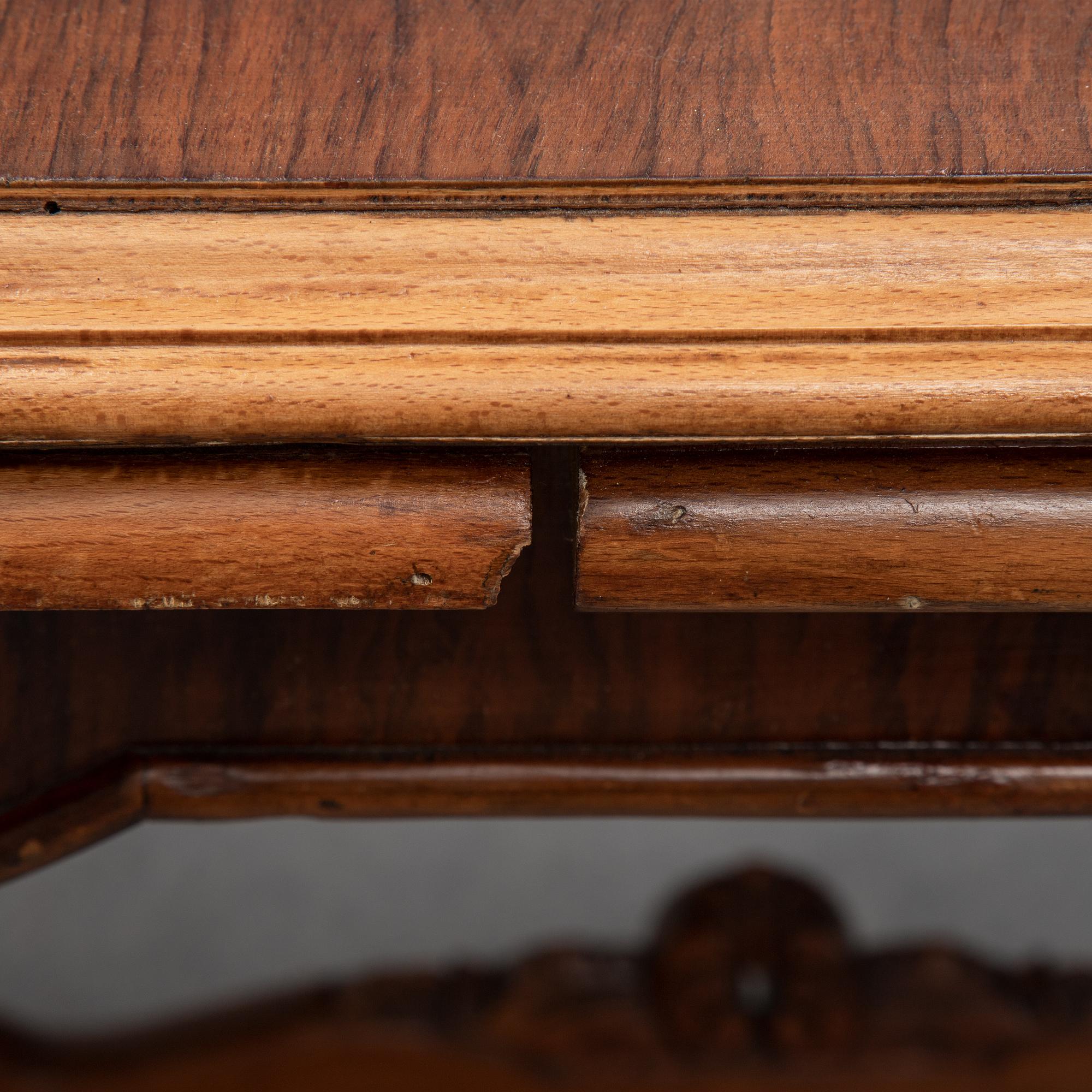 A first halg of the 20th Century walnut veneered table.