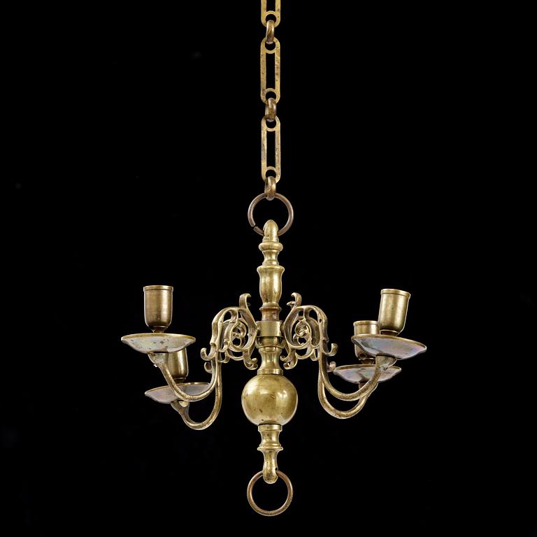 A four-branch baroque brass chandelier, late 17th century/circa 1700.