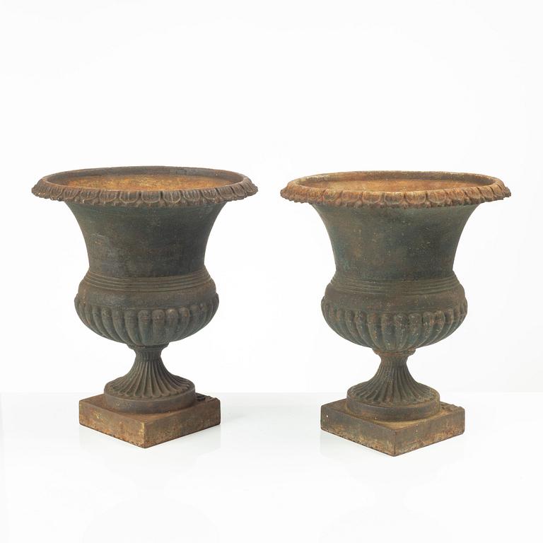Garden urns, a pair, cast iron, marked No 15, 20th Century.