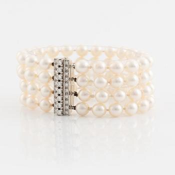 Four strand cultured pearl bracelet, clasp white gold with brilliant cut diamonds.