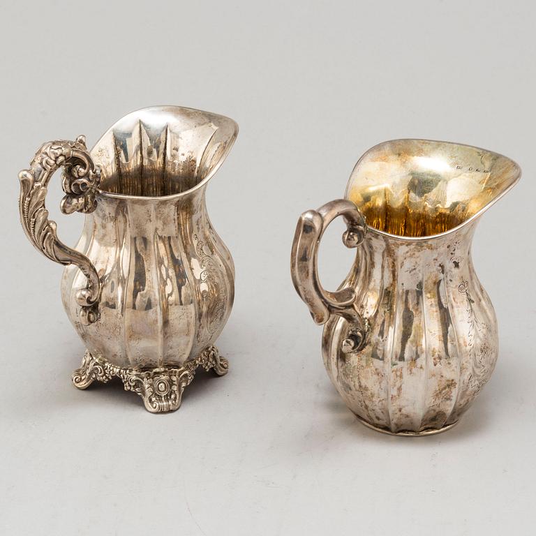 Two Swedish mid 19th century silver cream jugs.