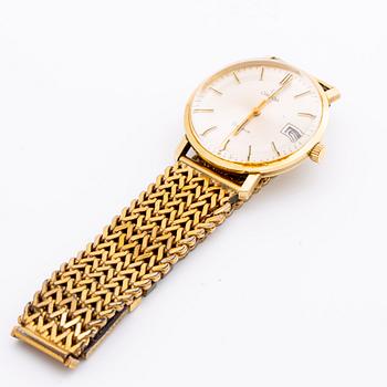 An Omega 14K gold wrist watch.