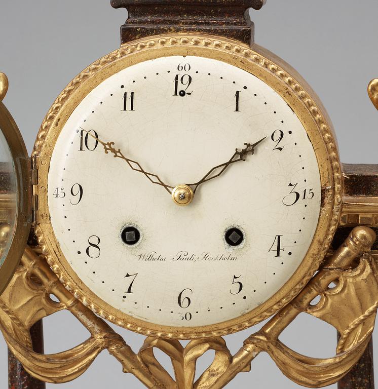 A late Gustavian porphyry imitation and gilt wood mantel clock by W. Pauli.