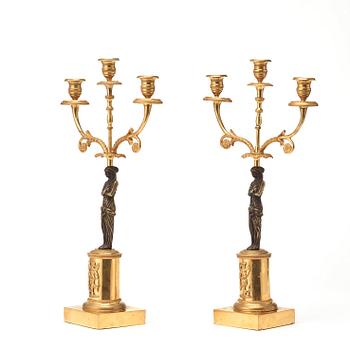 A pair of late Gustavian circa 1800 three-light candelabra.