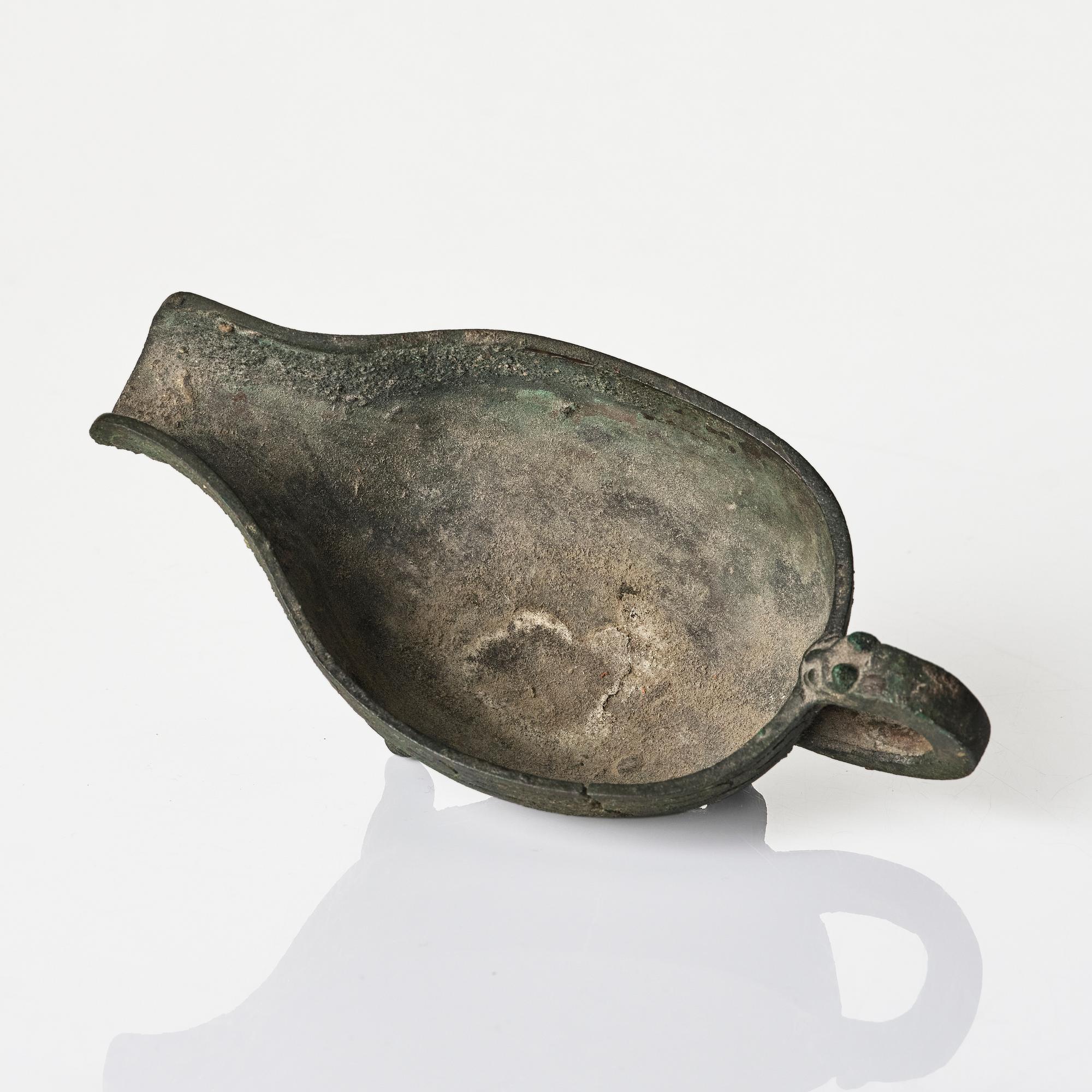 A Chinese brushpot, Qing dynasty, circa 1900. An archaistic bronze ewer and a silvered South East Asian bowl with stand.