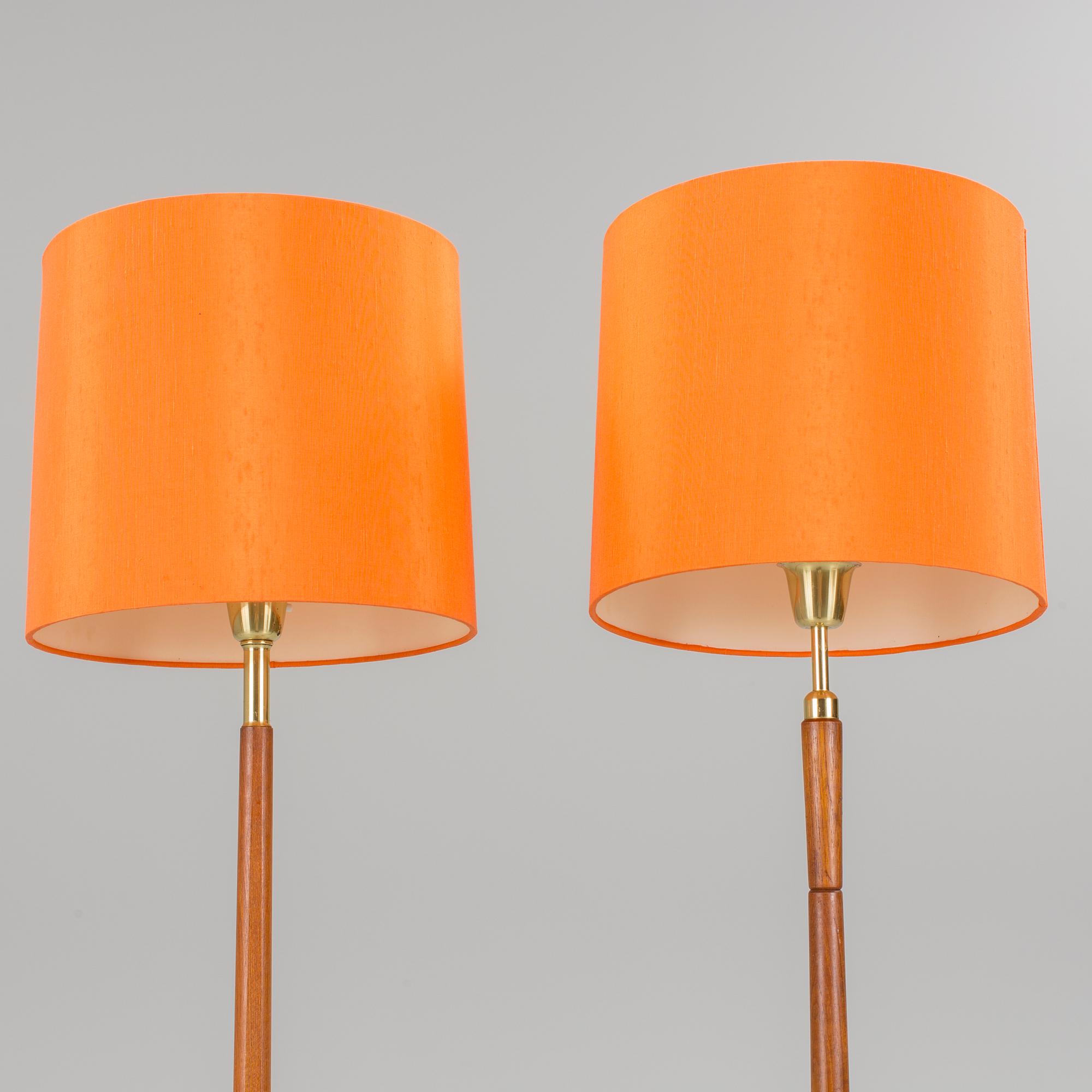 Two floor lamps in teak and brass from the 1960s/70s.