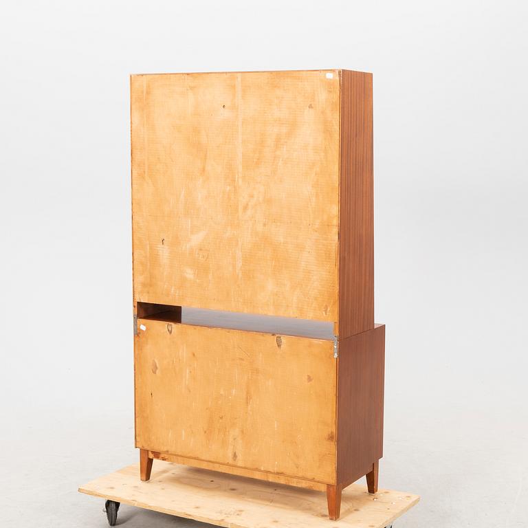 A 1940s mahogany book shelf with writing desk.