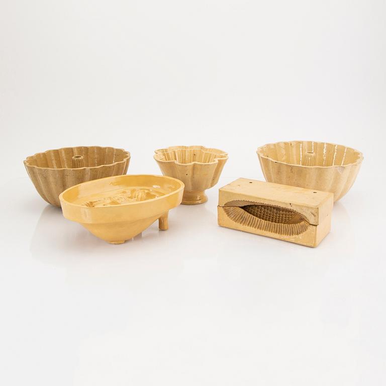 A set of five glazed earthenware moulds from Höganäs around 1900.