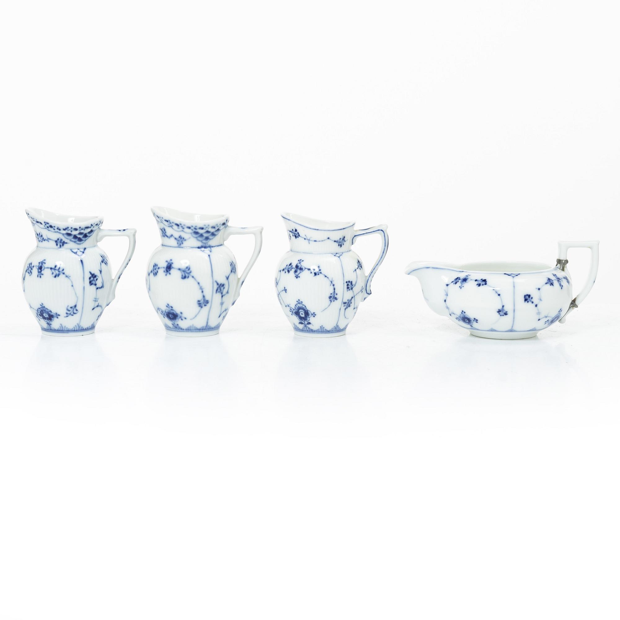 Royal Copenhagen, Lot of porcelain, 7 pieces, “Musselmalet”, coffee pot, chocolate pot, water jug, sauce boat, 3 cream jugs, 20th century.